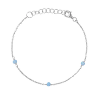 Silver bracelet with opal beads on a white background
