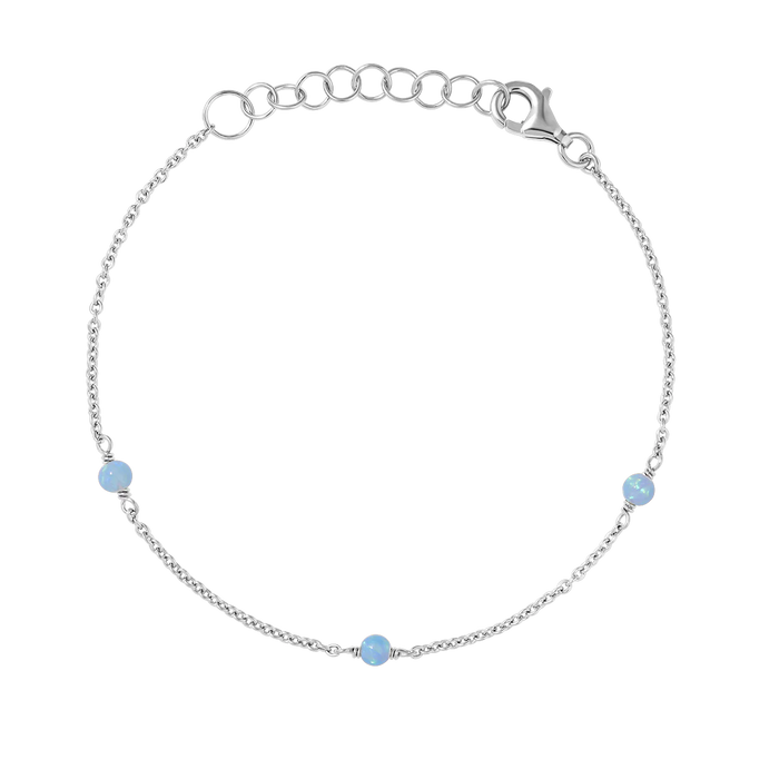 Silver bracelet with opal beads on a white background