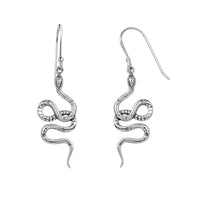 Silver snake-shaped earrings on a white background