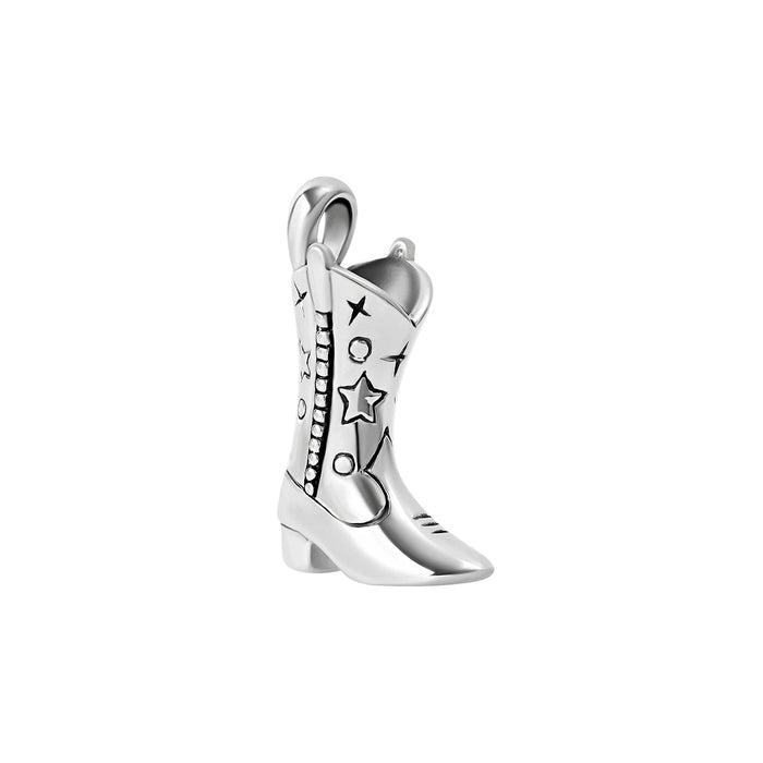 Silver cowgirl boot charm with star and moon designs on a white background