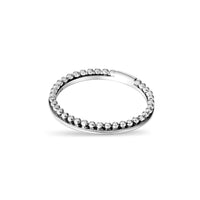 Silver beaded ring on a white background