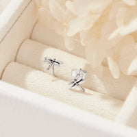 Silver Dragonfly earrings on a soft beige background