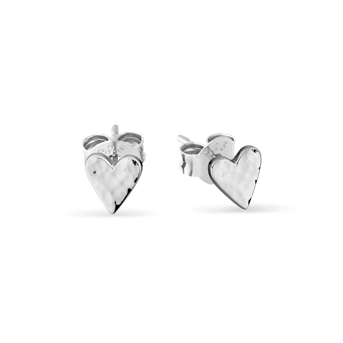 Heart-shaped silver earrings on a white background
